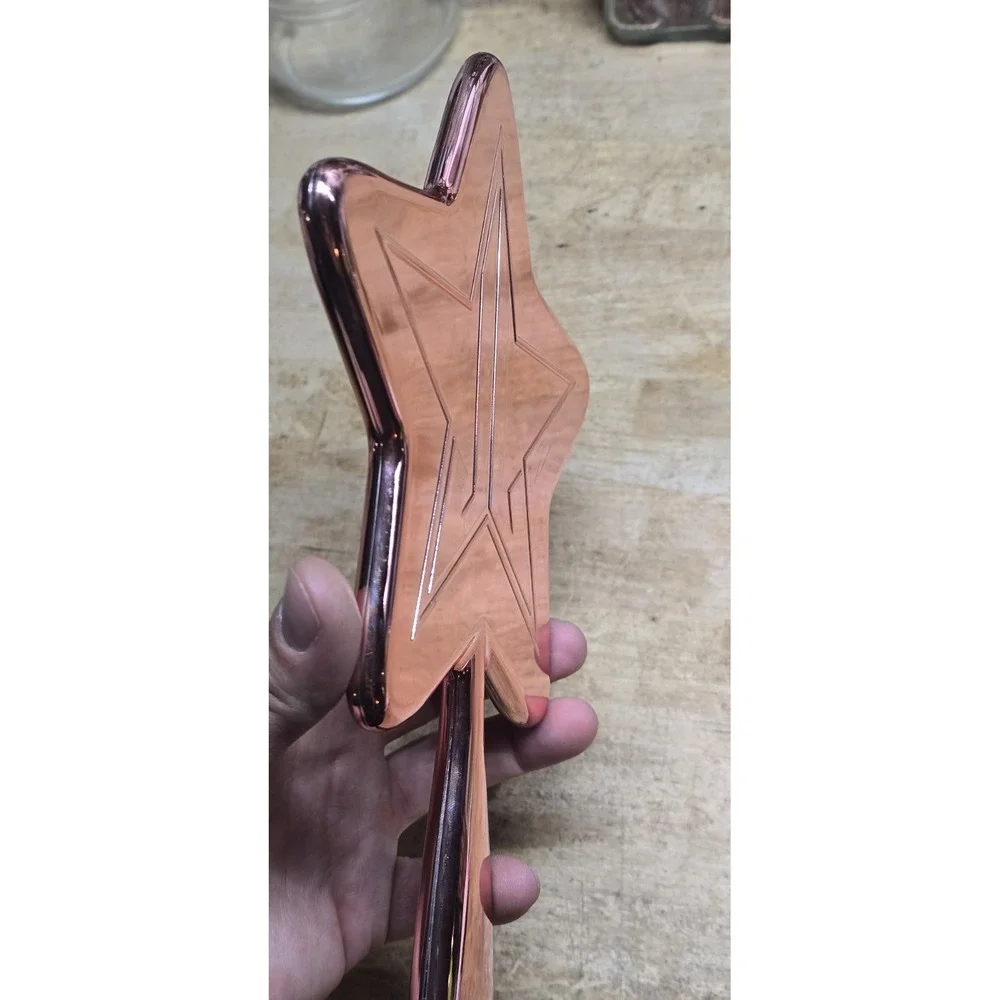 Jeffree Star Cosmetics Rose Gold Chrome Star Hand Mirror.